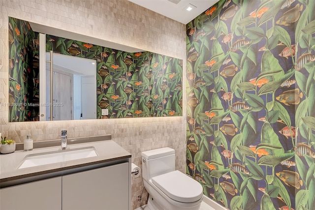 68 SE 6th St Unit 3911, Miami, FL 33131 - bathroom with vanity, tile walls, and toilet