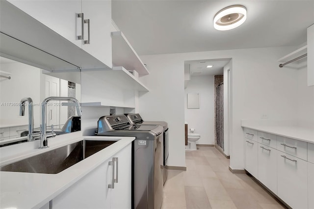 68 SE 6th St Unit 3911, Miami, FL 33131 - laundry room with separate washer and dryer and sink