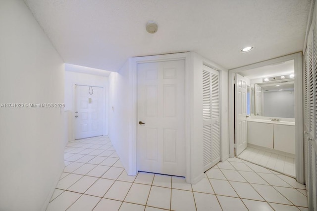 hallway with light tile patterned flooring