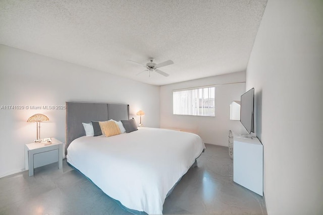 bedroom featuring ceiling fan and a textured ceiling