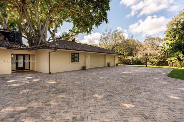 view of side of property with a garage