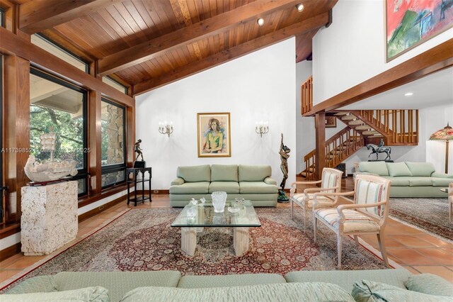 tiled living room with vaulted ceiling with beams and wood ceiling