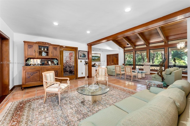 living room featuring light tile patterned floors, a notable chandelier, and lofted ceiling with beams