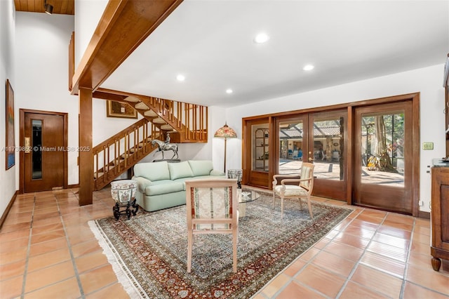 living room featuring french doors and tile patterned flooring