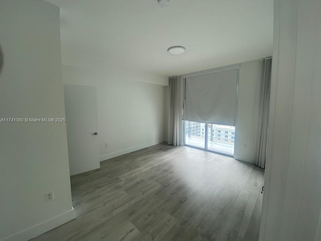 empty room with light wood-type flooring