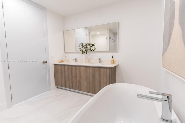 bathroom with vanity and a bathtub