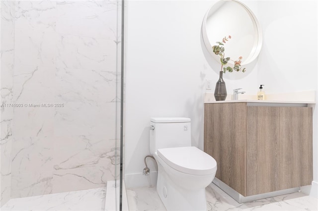 bathroom with vanity, toilet, and a shower