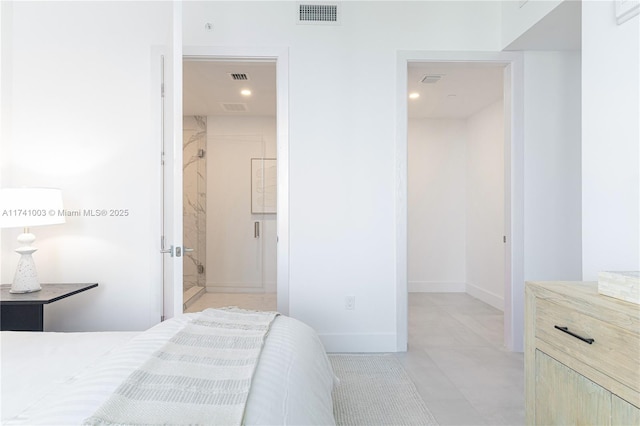 bedroom with a walk in closet and a closet