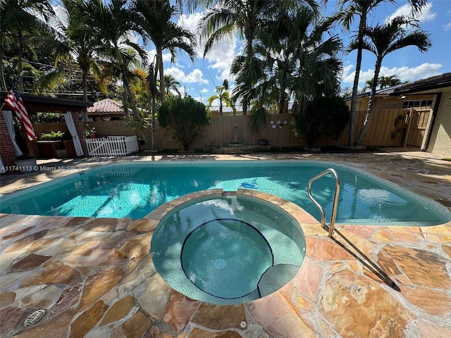 view of pool with a gazebo, a patio, and an in ground hot tub