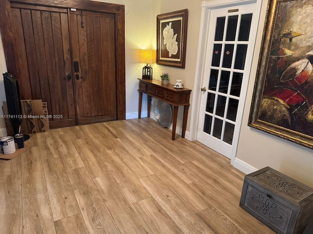 entryway with light hardwood / wood-style floors