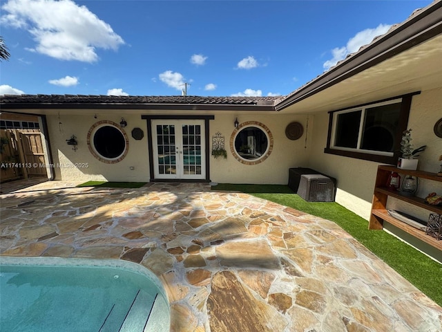 exterior space with french doors and a patio