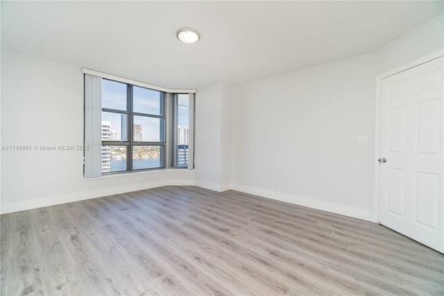 3530 Mystic Pointe Dr Unit 1513, Aventura, FL 33180 - spare room with light hardwood / wood-style floors
