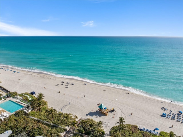 birds eye view of property featuring a view of the beach and a water view