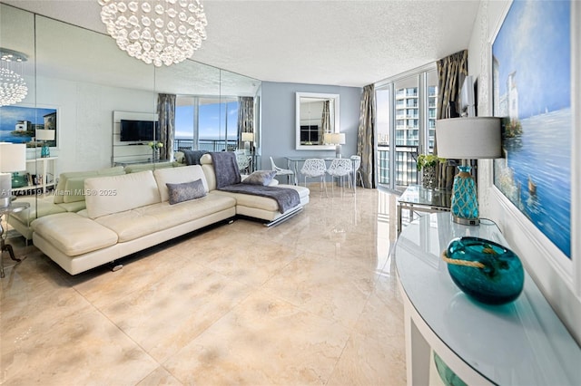 living room with an inviting chandelier, a wall of windows, and a textured ceiling