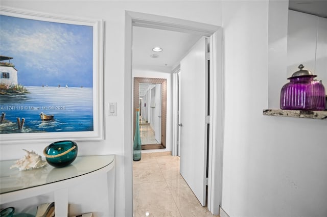 hall featuring light tile patterned floors