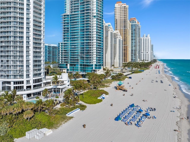 exterior space featuring a water view and a view of the beach