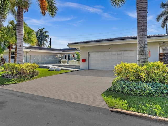 ranch-style home with a garage