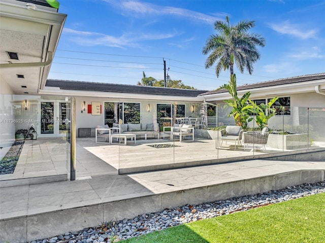 exterior space featuring an outdoor hangout area and french doors