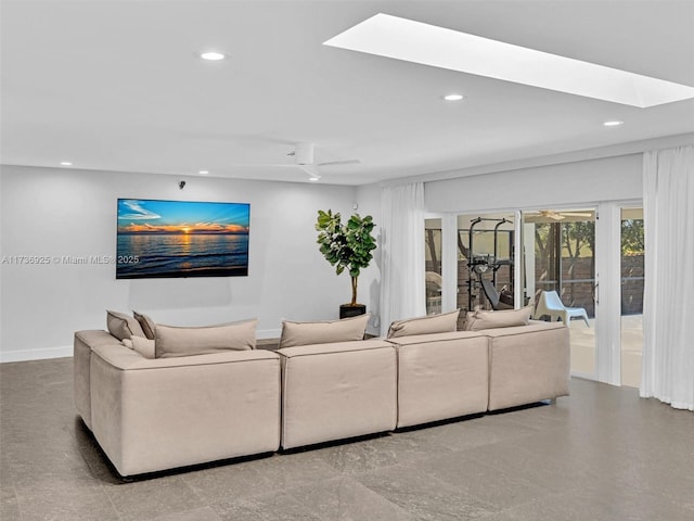 living room featuring a skylight