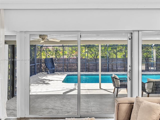 view of swimming pool featuring ceiling fan