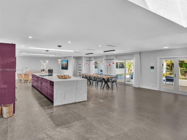 kitchen with a large island and decorative light fixtures