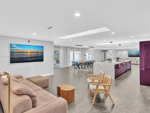 living room featuring concrete flooring