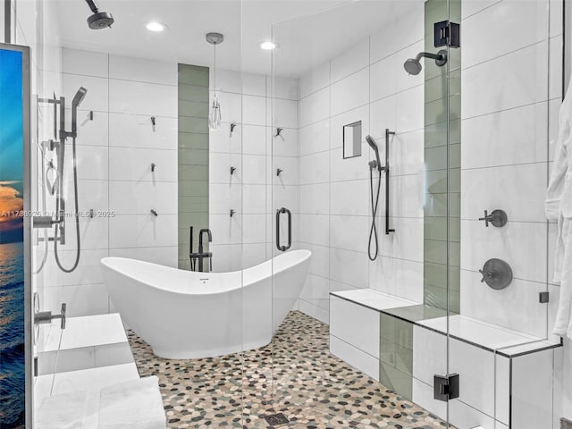 bathroom featuring independent shower and bath and tile walls