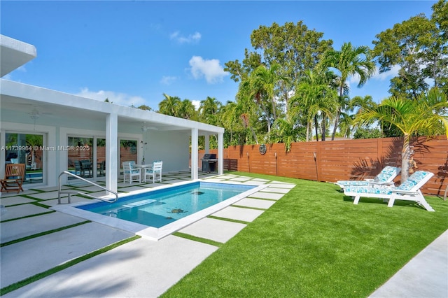 view of swimming pool with a fenced in pool, a patio, a fenced backyard, a grill, and a yard