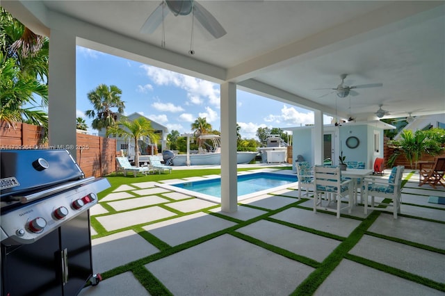 view of patio / terrace with a fenced in pool, area for grilling, a ceiling fan, outdoor dining space, and a fenced backyard