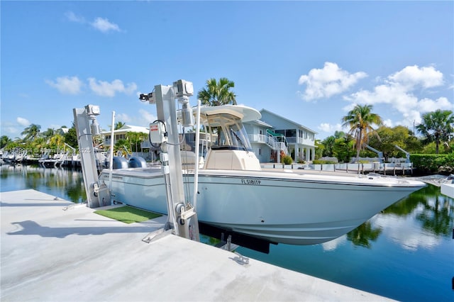 dock area featuring a water view and boat lift