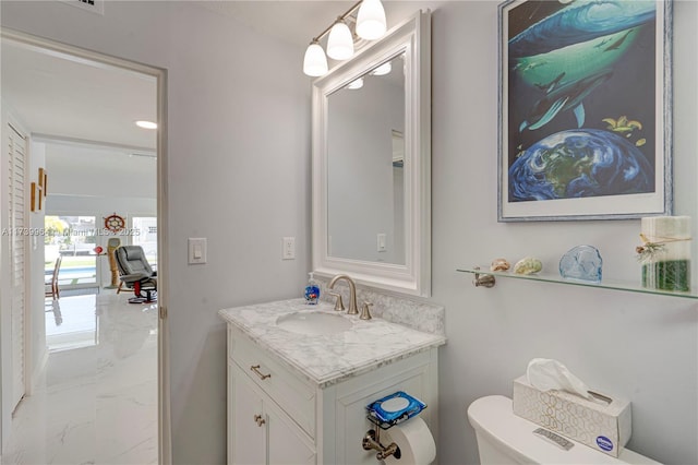 half bath featuring toilet, marble finish floor, and vanity