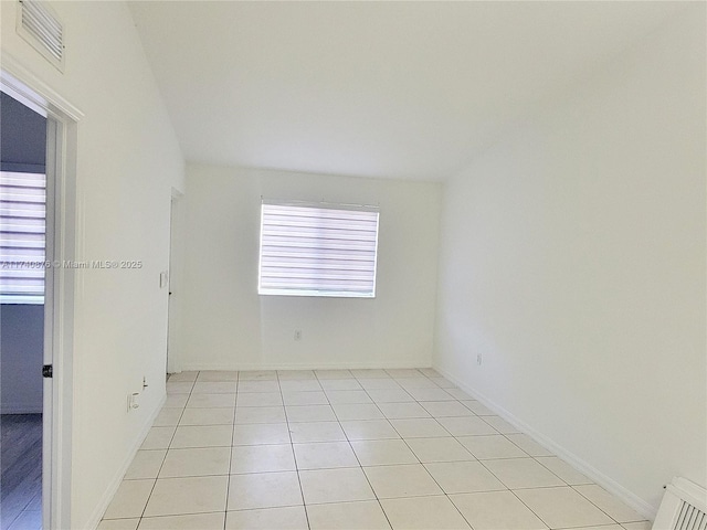 view of tiled spare room