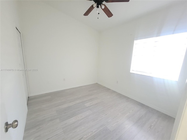 unfurnished room with ceiling fan and light hardwood / wood-style flooring