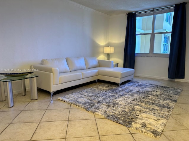 tiled living room featuring ornamental molding and a textured ceiling