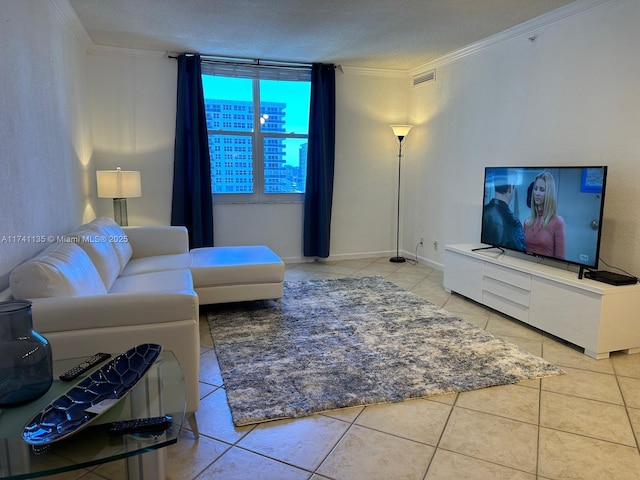 living room with ornamental molding, light tile patterned flooring, and a textured ceiling