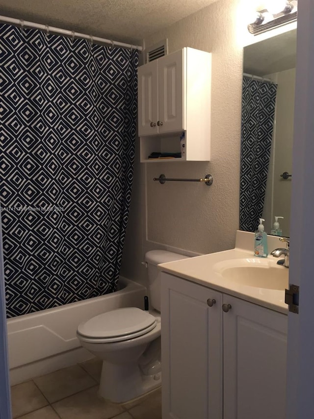 full bathroom with toilet, a textured ceiling, shower / tub combination, vanity, and tile patterned flooring