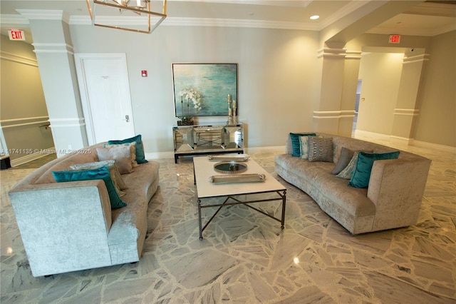 living room featuring ornamental molding and ornate columns