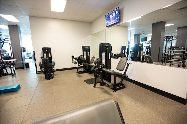 gym featuring a paneled ceiling