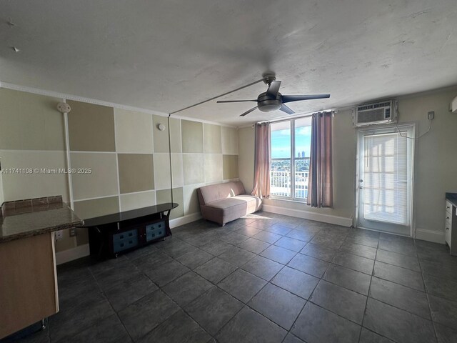 unfurnished room with a wall mounted air conditioner, crown molding, and ceiling fan