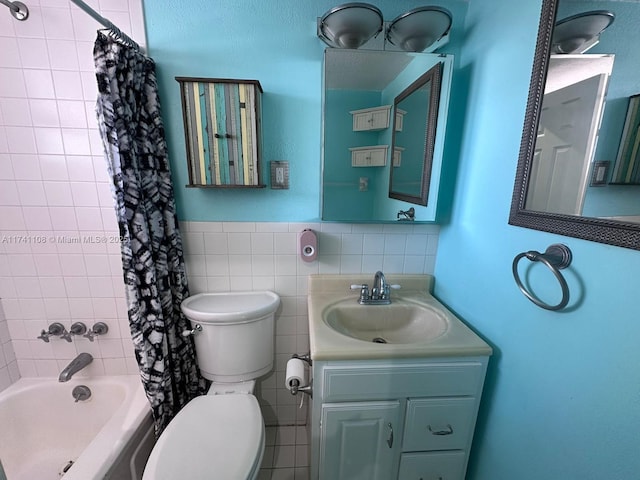 full bathroom with tile walls, vanity, shower / bath combination with curtain, and toilet