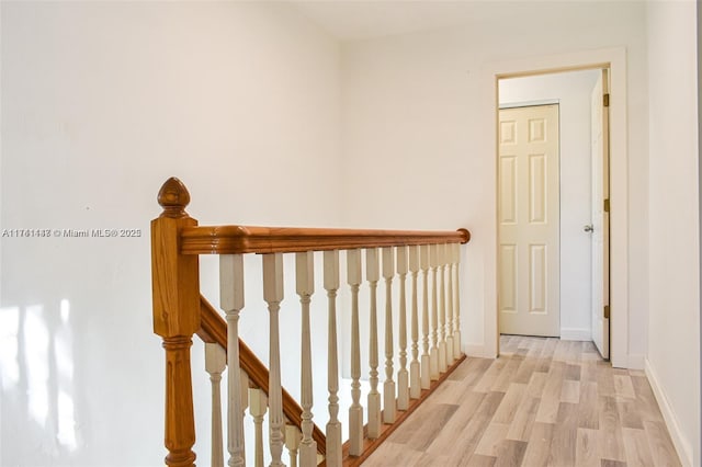 hall with light hardwood / wood-style floors