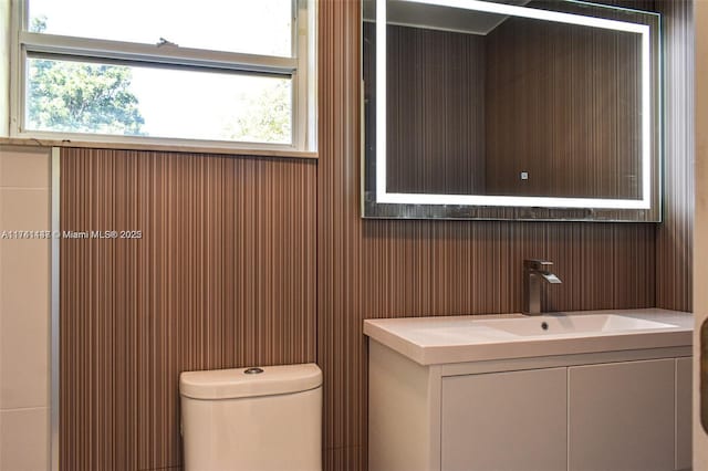 bathroom featuring vanity and toilet