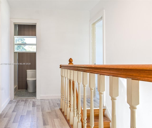 stairs featuring wood-type flooring