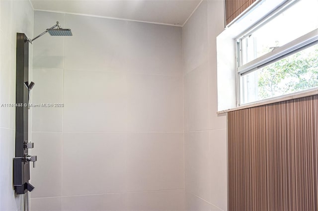 bathroom with a tile shower