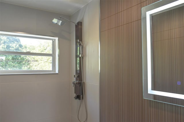 interior space with tiled shower