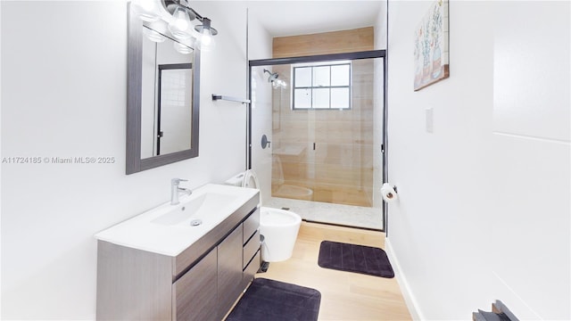 bathroom with vanity and a shower with shower door