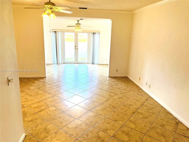 tiled empty room featuring ceiling fan, crown molding, french doors, and a textured ceiling