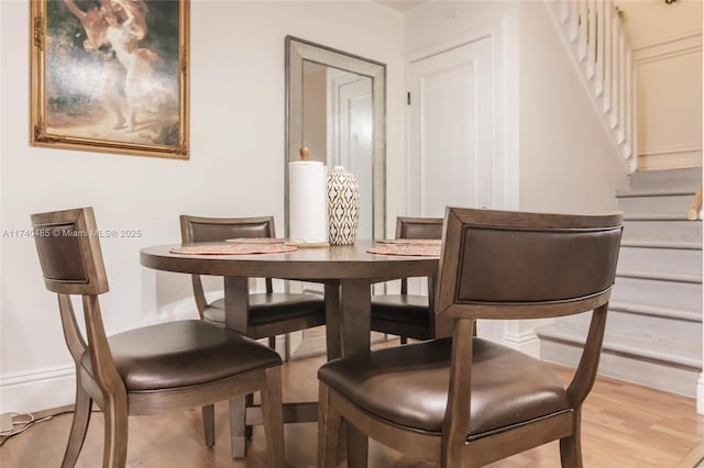 dining space featuring light hardwood / wood-style floors