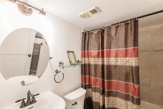 bathroom with sink and toilet