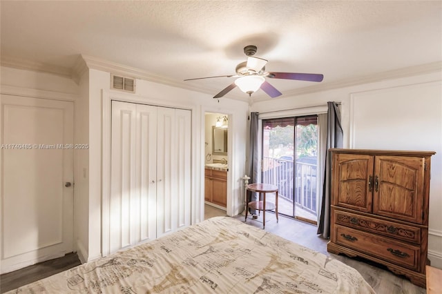 unfurnished bedroom featuring access to exterior, ornamental molding, a textured ceiling, and ceiling fan